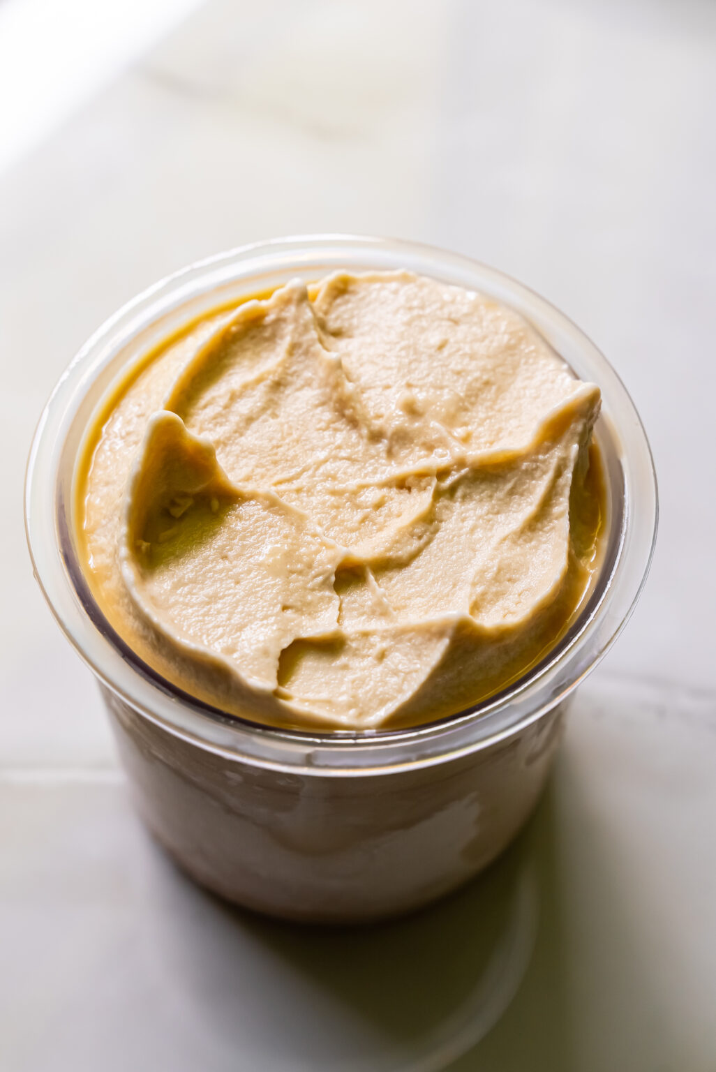 Oat Milk Protein Coffee ice cream in a clear pint
